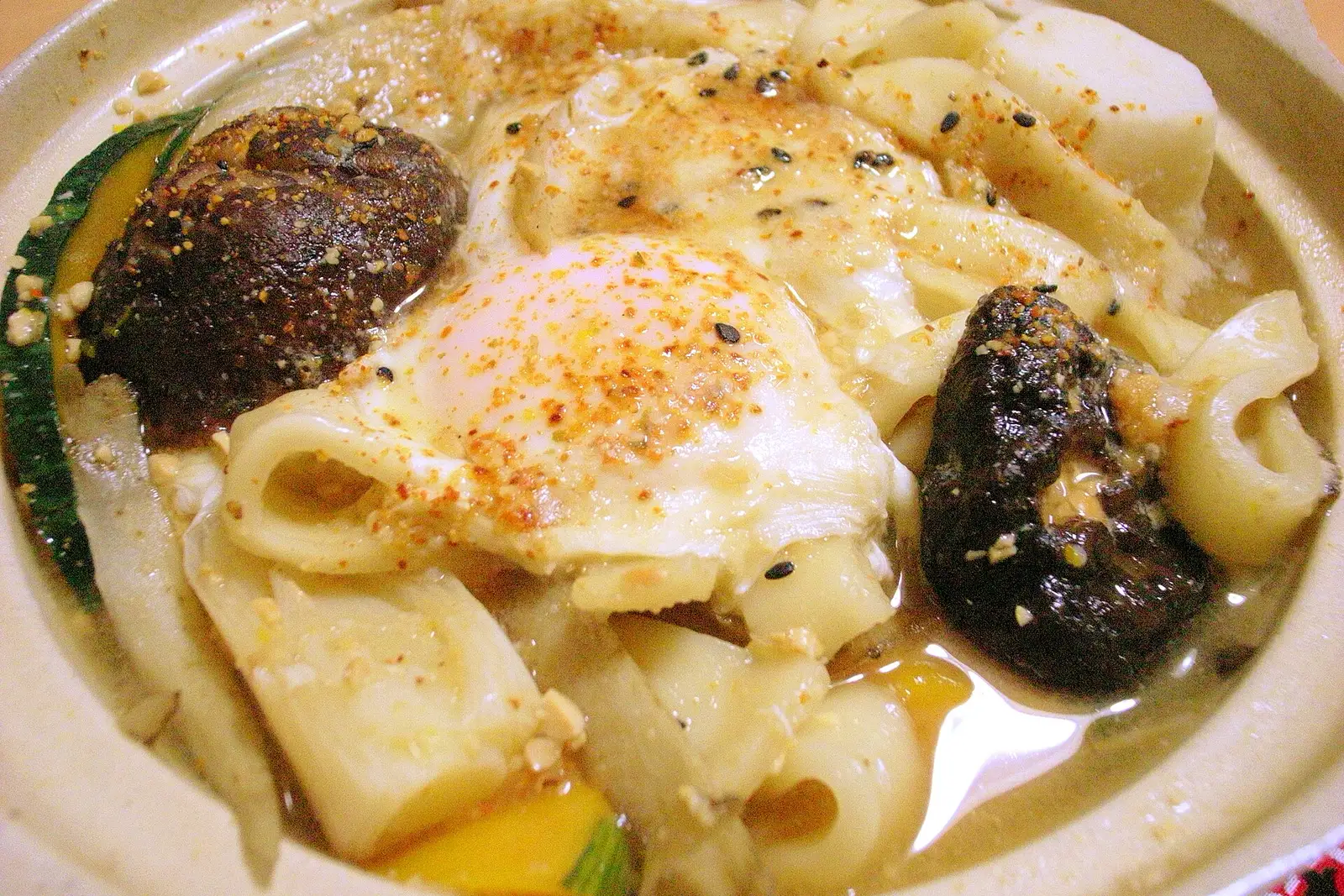 Hoto with an egg, shiitake and pumpkin in a clay pot